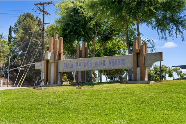 a swimming pool with outdoor seating and yard