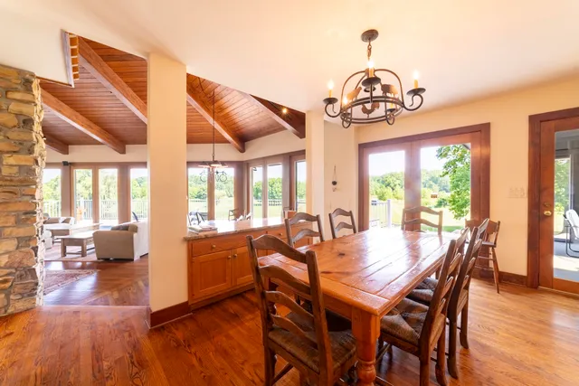 a kitchen with stainless steel appliances granite countertop a stove a sink and a refrigerator with cabinets