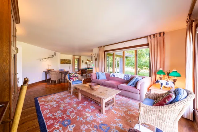 a bathroom with a granite countertop double vanity sink and a mirror