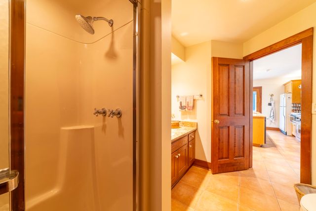 a bedroom with two beds and a large window