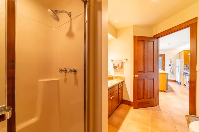 a bedroom with two beds and a large window