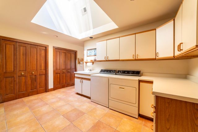 a bed room with a bed and a chair