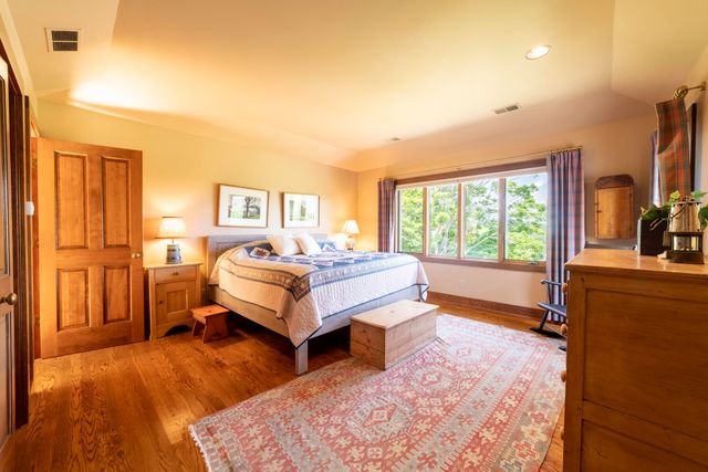 a bathroom with a shower and toilet