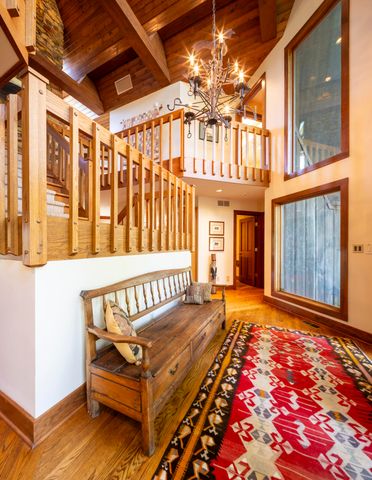 a kitchen with stainless steel appliances granite countertop a refrigerator a stove and a sink