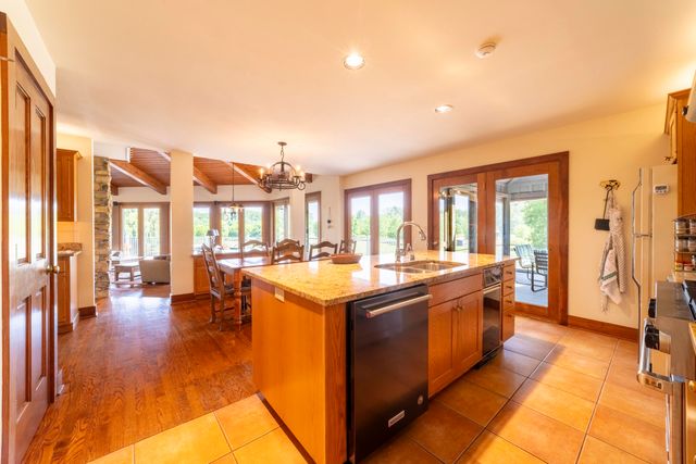 a living room with fireplace furniture and a fireplace