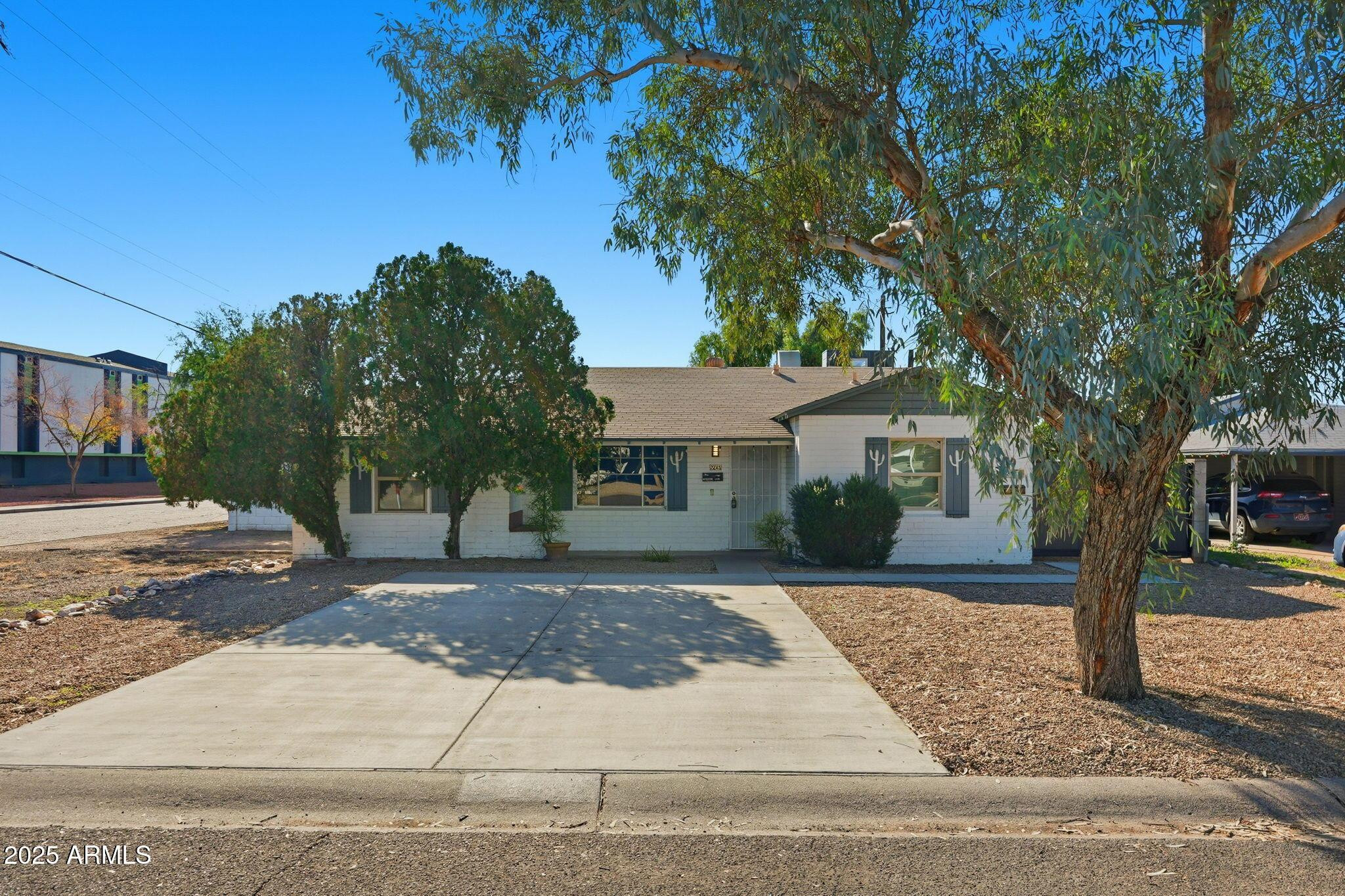 front view of a house with a yard