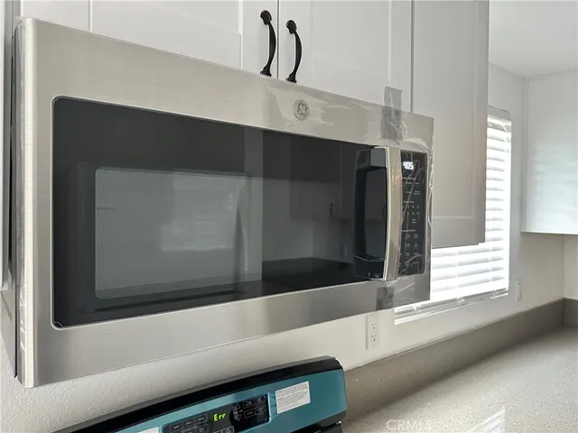a bathroom with a bathtub and a window