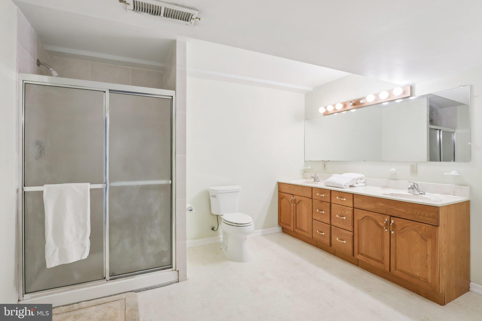 1 Daisy Lane Ambler, PA 19002 - Photo 38 of 53 a spacious bathroom with a double vanity sink toilet and shower