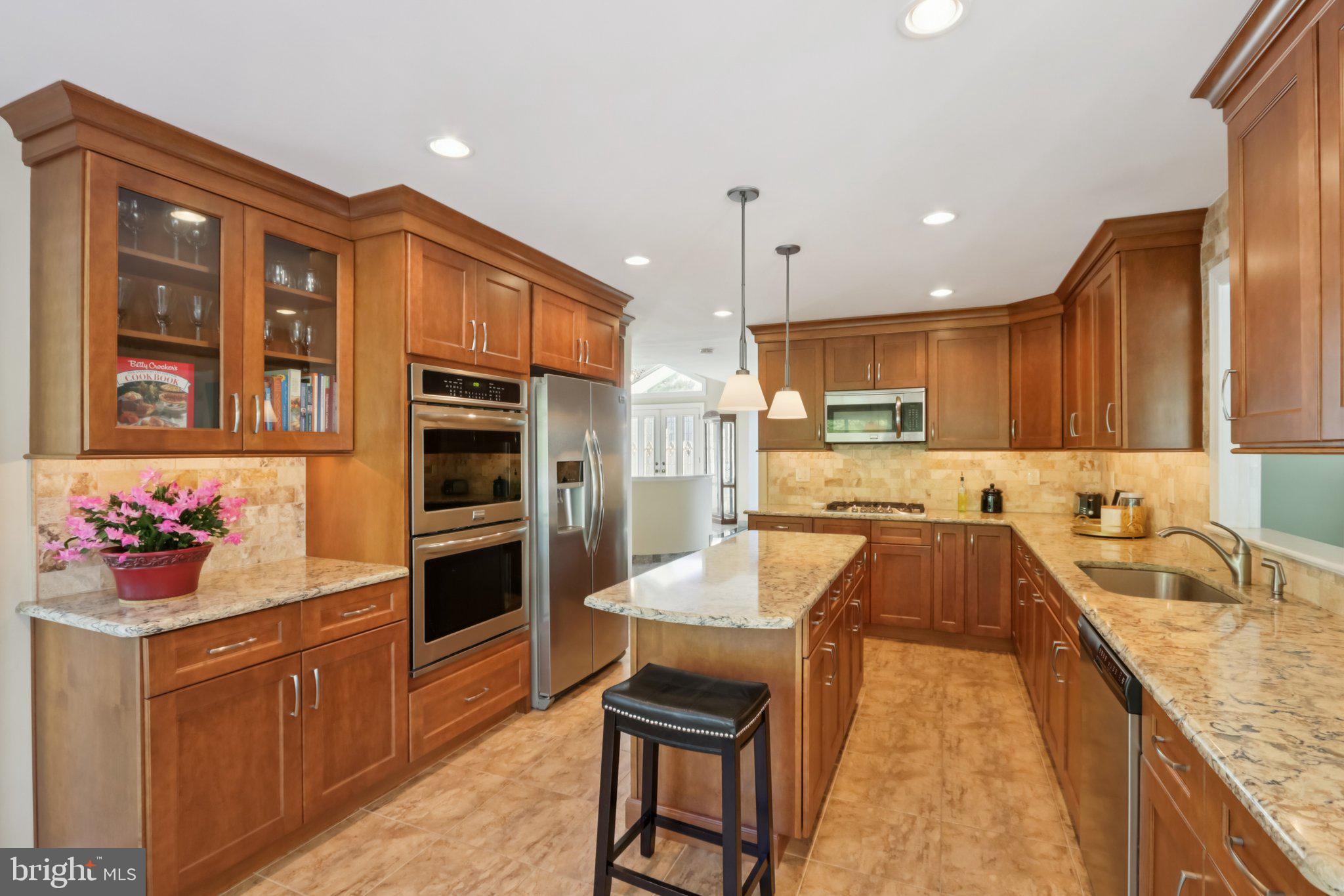 1 Daisy Lane Ambler, PA 19002 - Photo 9 of 53 a large kitchen with stainless steel appliances kitchen island granite countertop a sink and cabinets