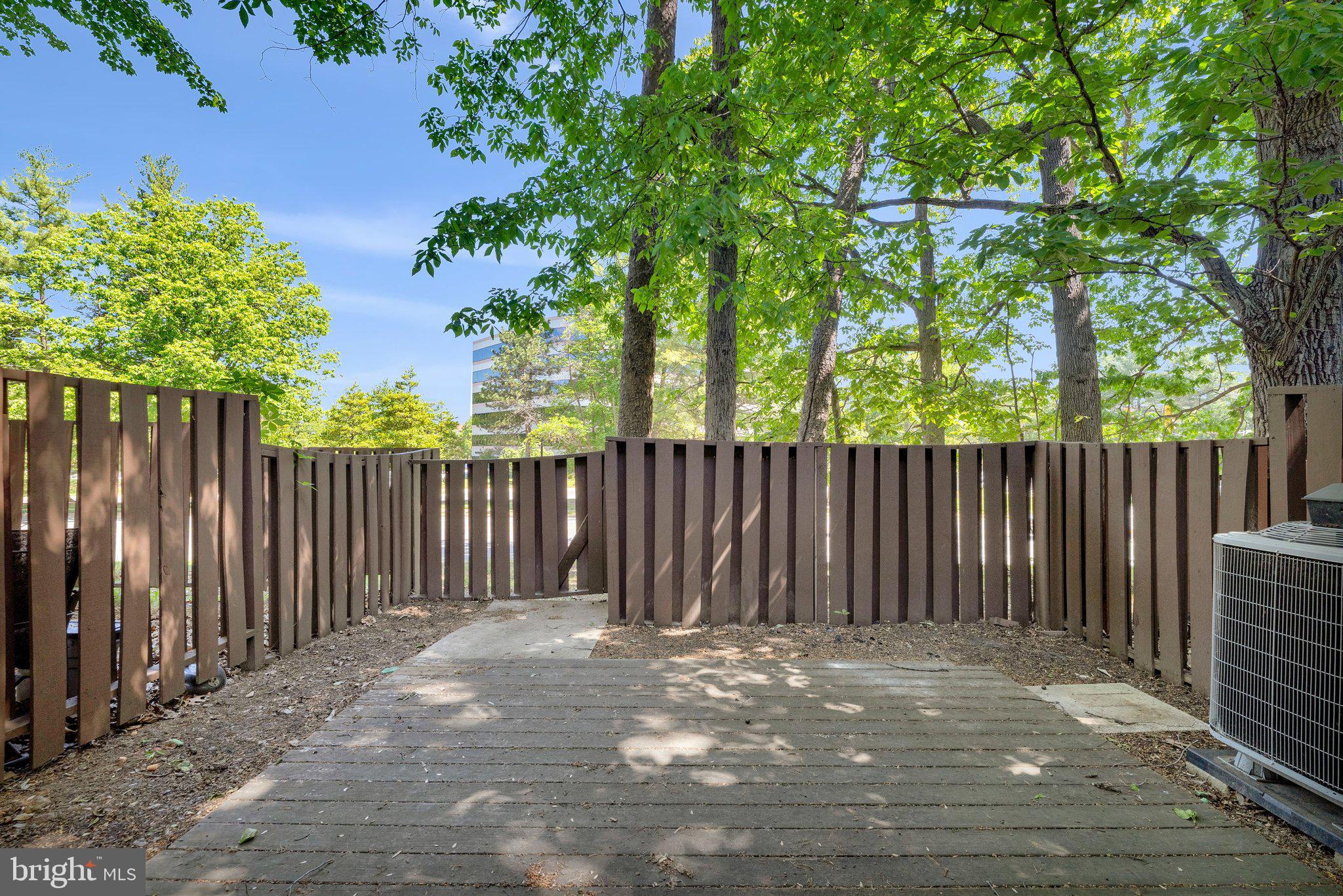 2202 Southgate Square Reston, VA 20191 - Photo 19 of 22 a view of a wooden fence