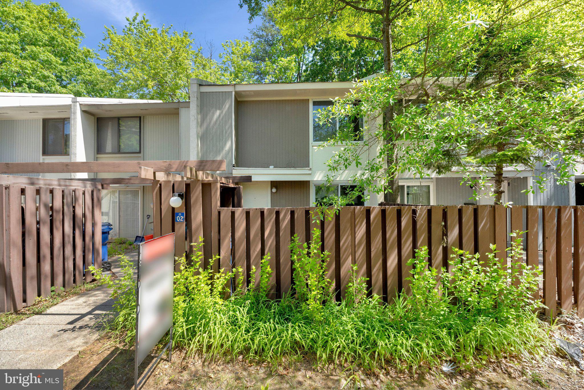 2202 Southgate Square Reston, VA 20191 - Photo 2 of 22 a view of front of house with a yard