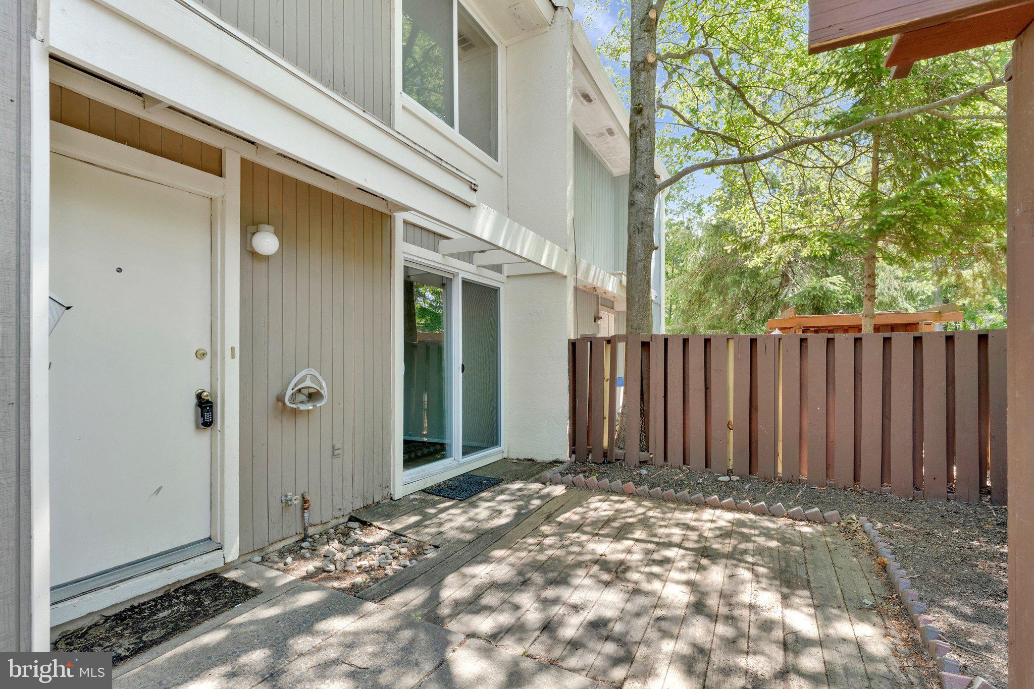 2202 Southgate Square Reston, VA 20191 - Photo 22 of 22 a view of a house with backyard of cabin and wooden fence
