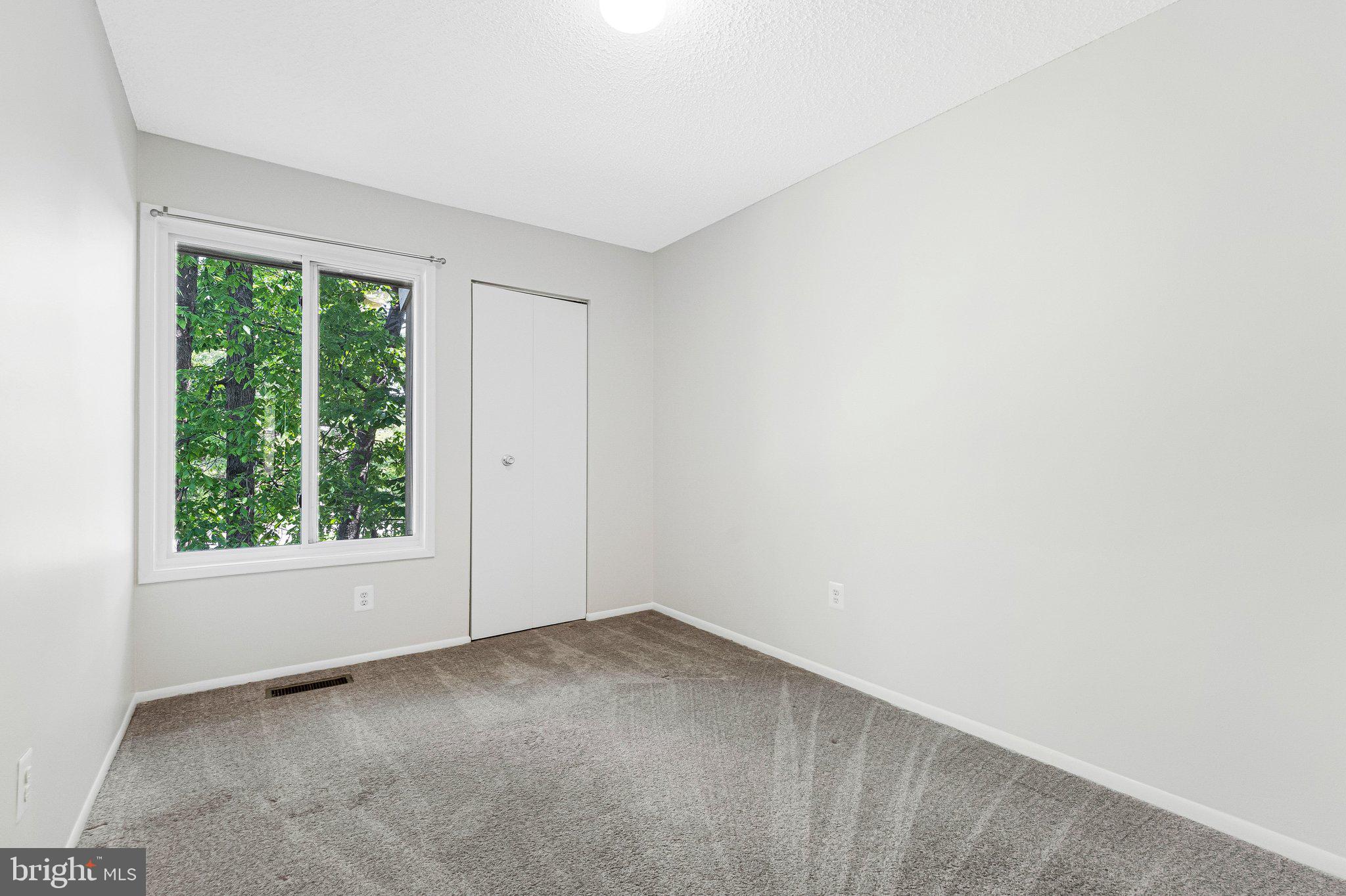2202 Southgate Square Reston, VA 20191 - Photo 4 of 22 an empty room with windows