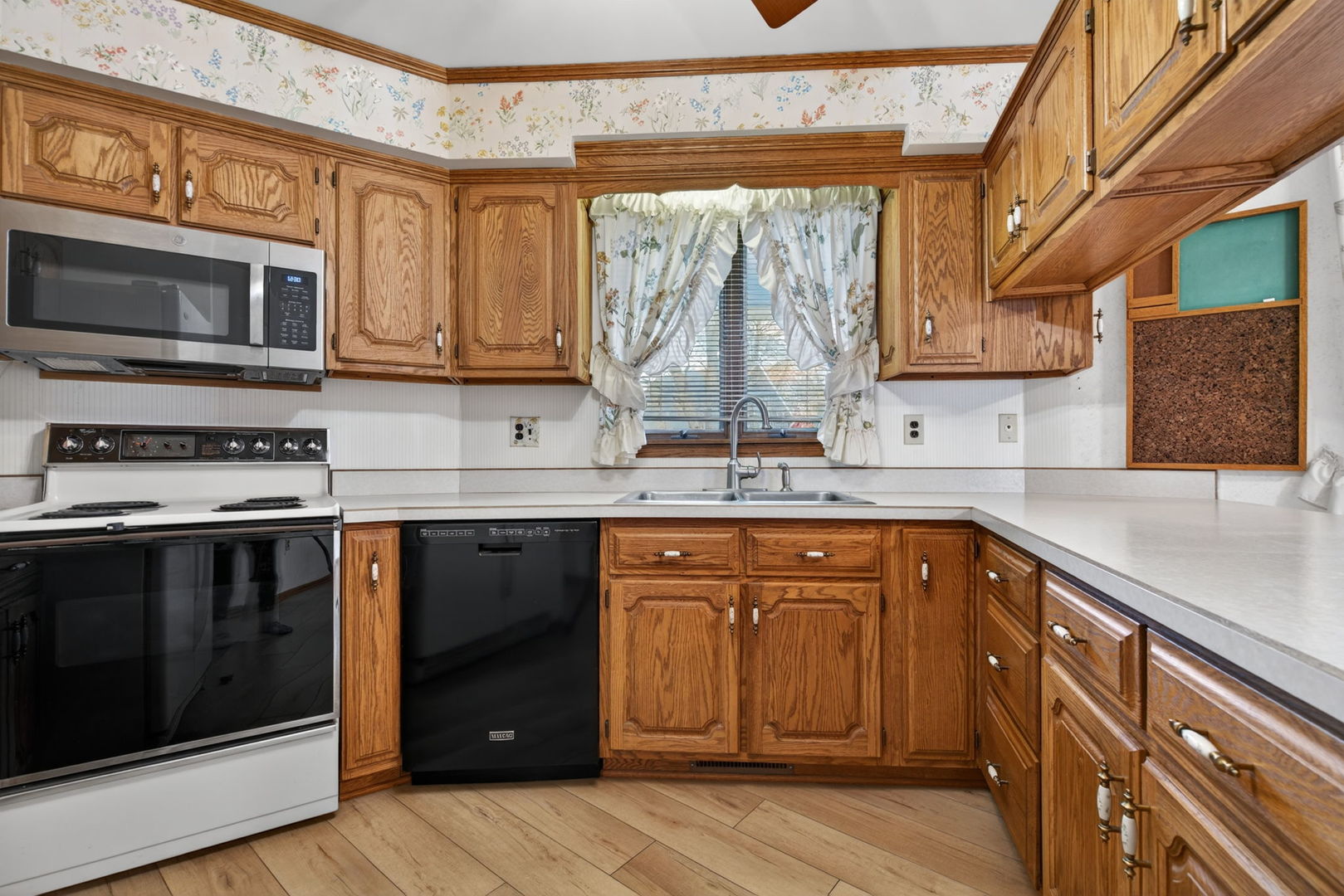 3420 Quail Court Morris, IL 60450 - Photo 12 of 53 a kitchen with stainless steel appliances granite countertop a stove a sink and a microwave