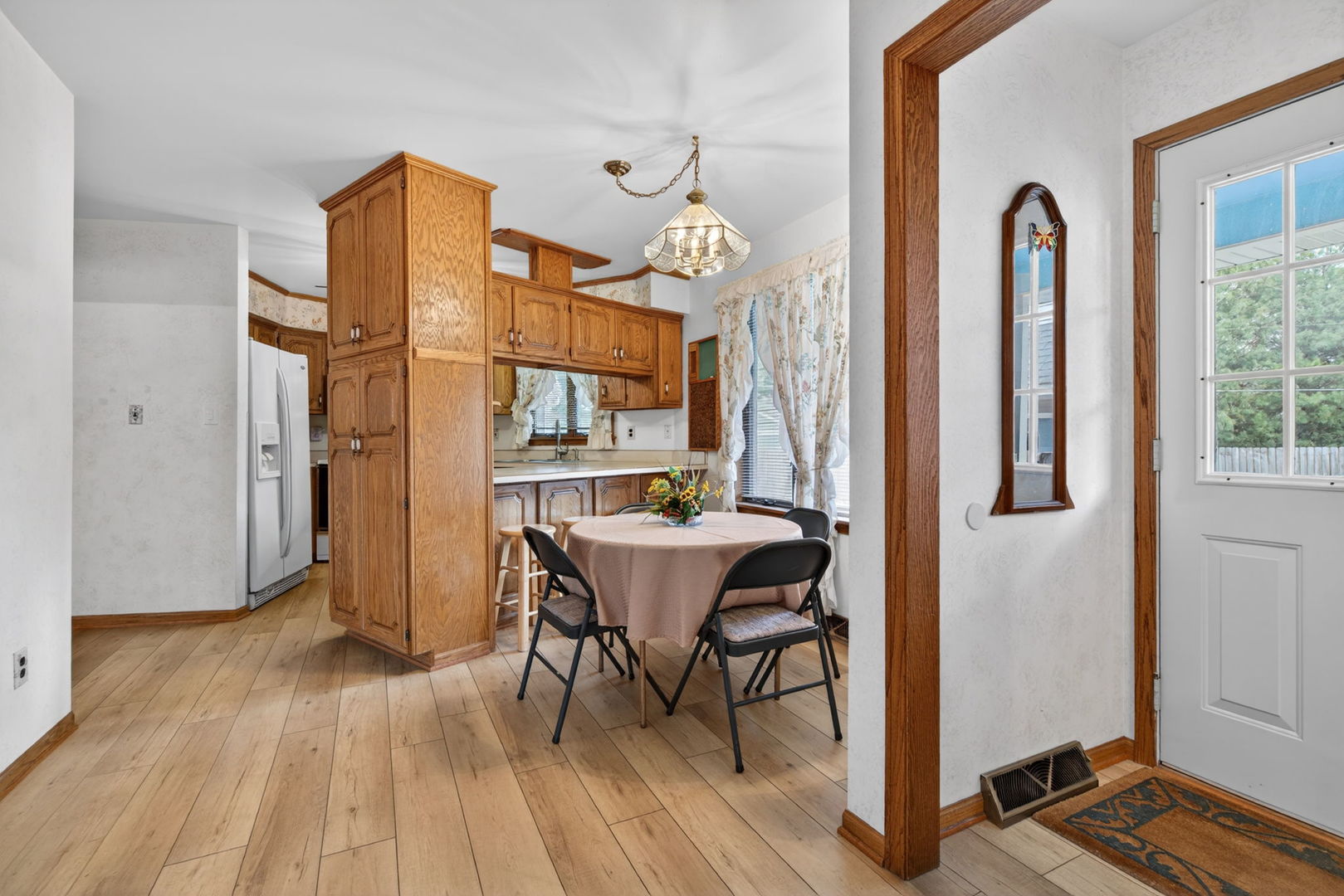 3420 Quail Court Morris, IL 60450 - Photo 7 of 53 a dining room with furniture a chandelier and wooden floor