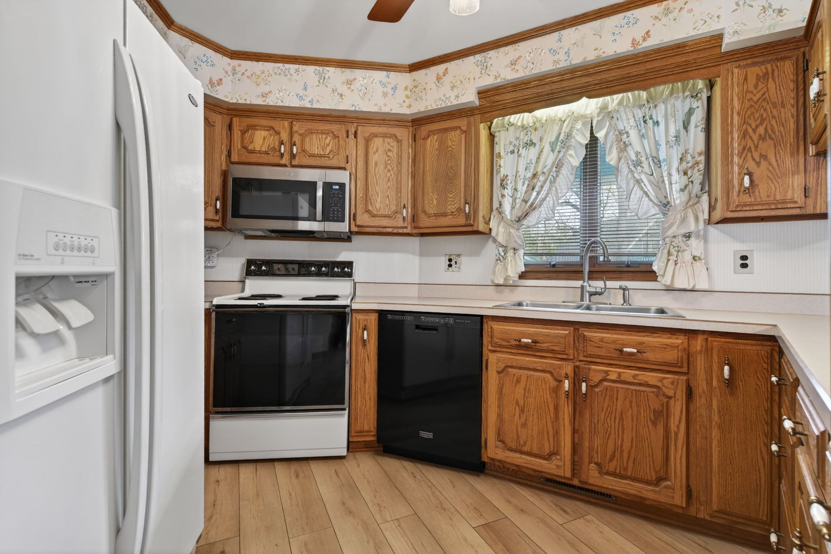3420 Quail Court Morris, IL 60450 - Photo 9 of 53 a kitchen with stainless steel appliances granite countertop a stove a sink and a microwave