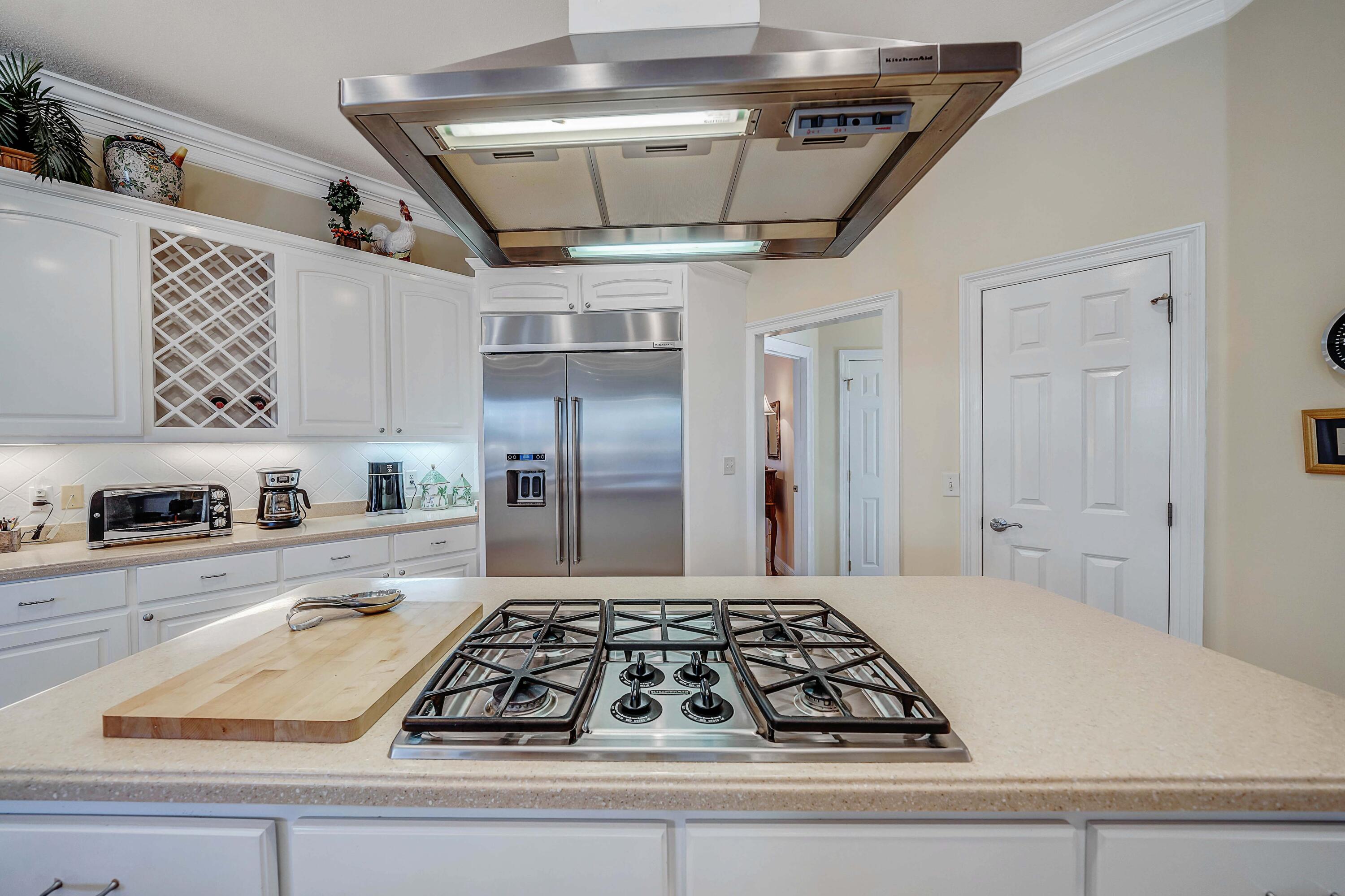 3601 Dragon's Ridge Road Panama City Beach, FL 32408 - Photo 15 of 62 a kitchen with kitchen island granite countertop a stove and a refrigerator
