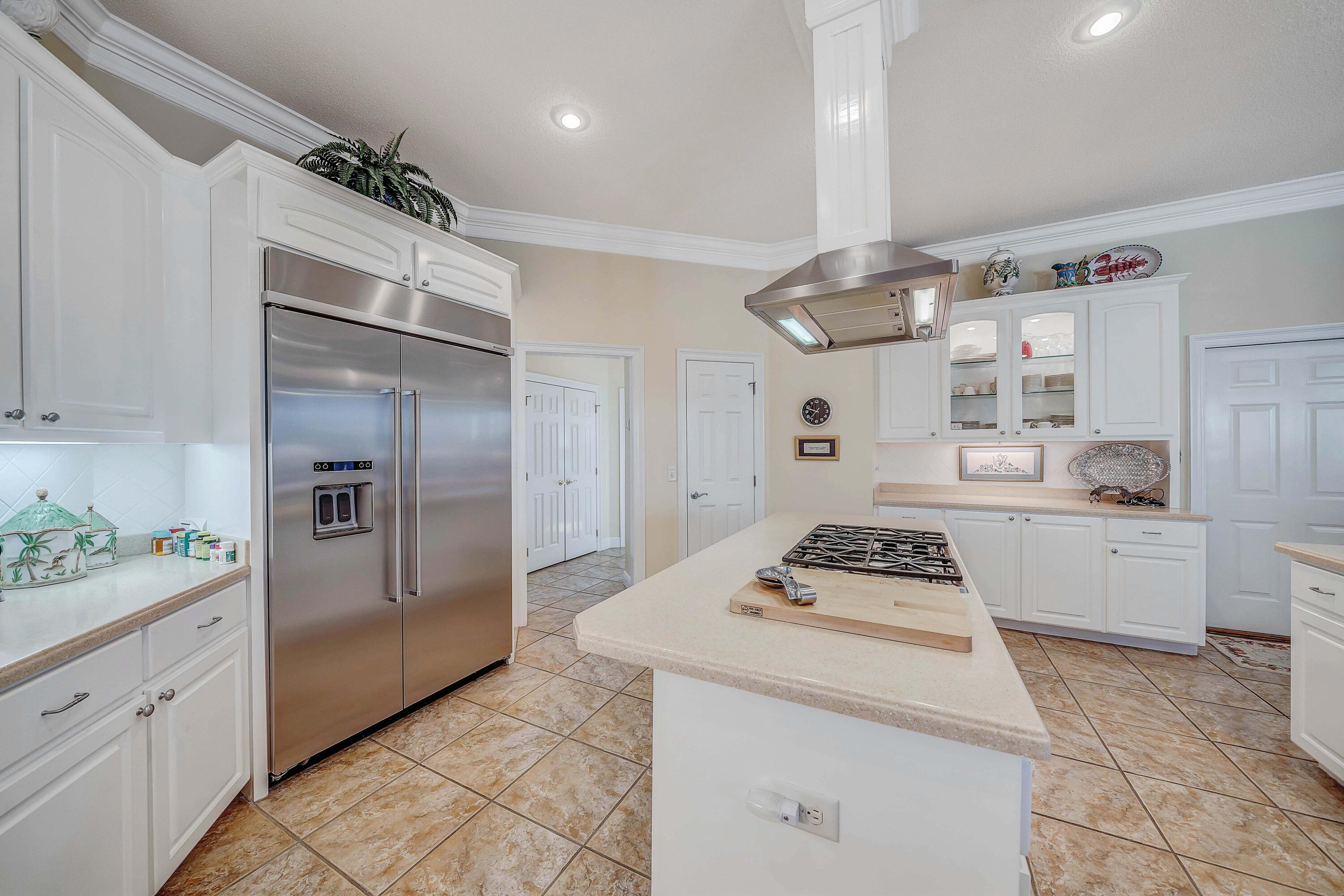 3601 Dragon's Ridge Road Panama City Beach, FL 32408 - Photo 17 of 62 a kitchen with granite countertop a sink stainless steel appliances and cabinets