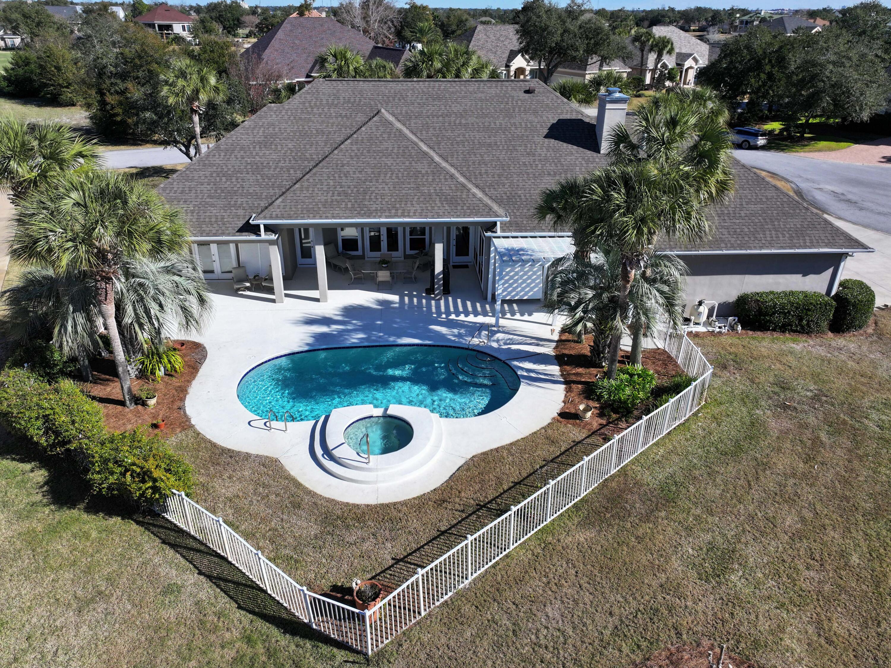 3601 Dragon's Ridge Road Panama City Beach, FL 32408 - Photo 2 of 62 a aerial view of a house with swimming pool and a yard