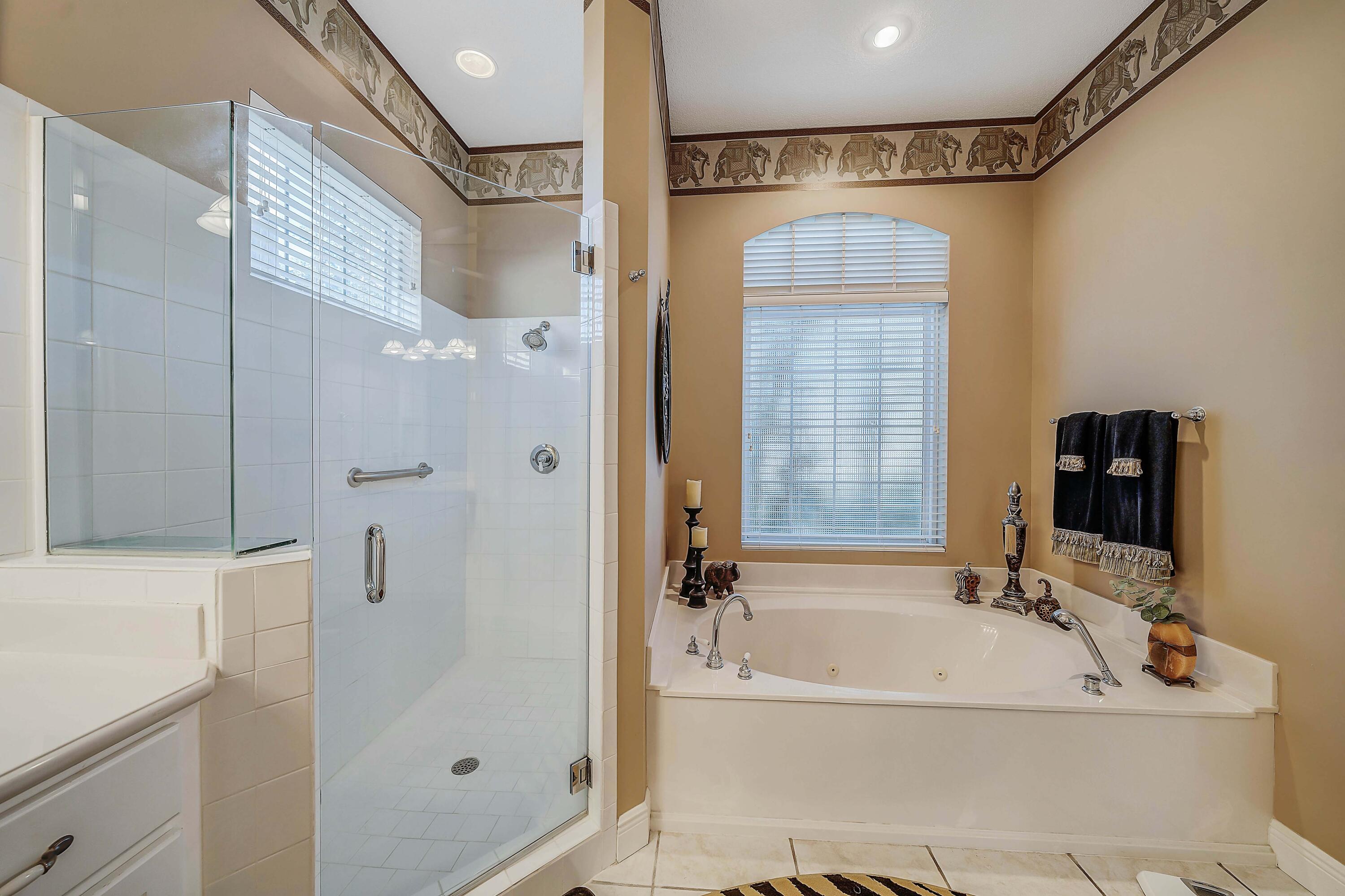 3601 Dragon's Ridge Road Panama City Beach, FL 32408 - Photo 27 of 62 a bathroom with a tub a sink and a shower