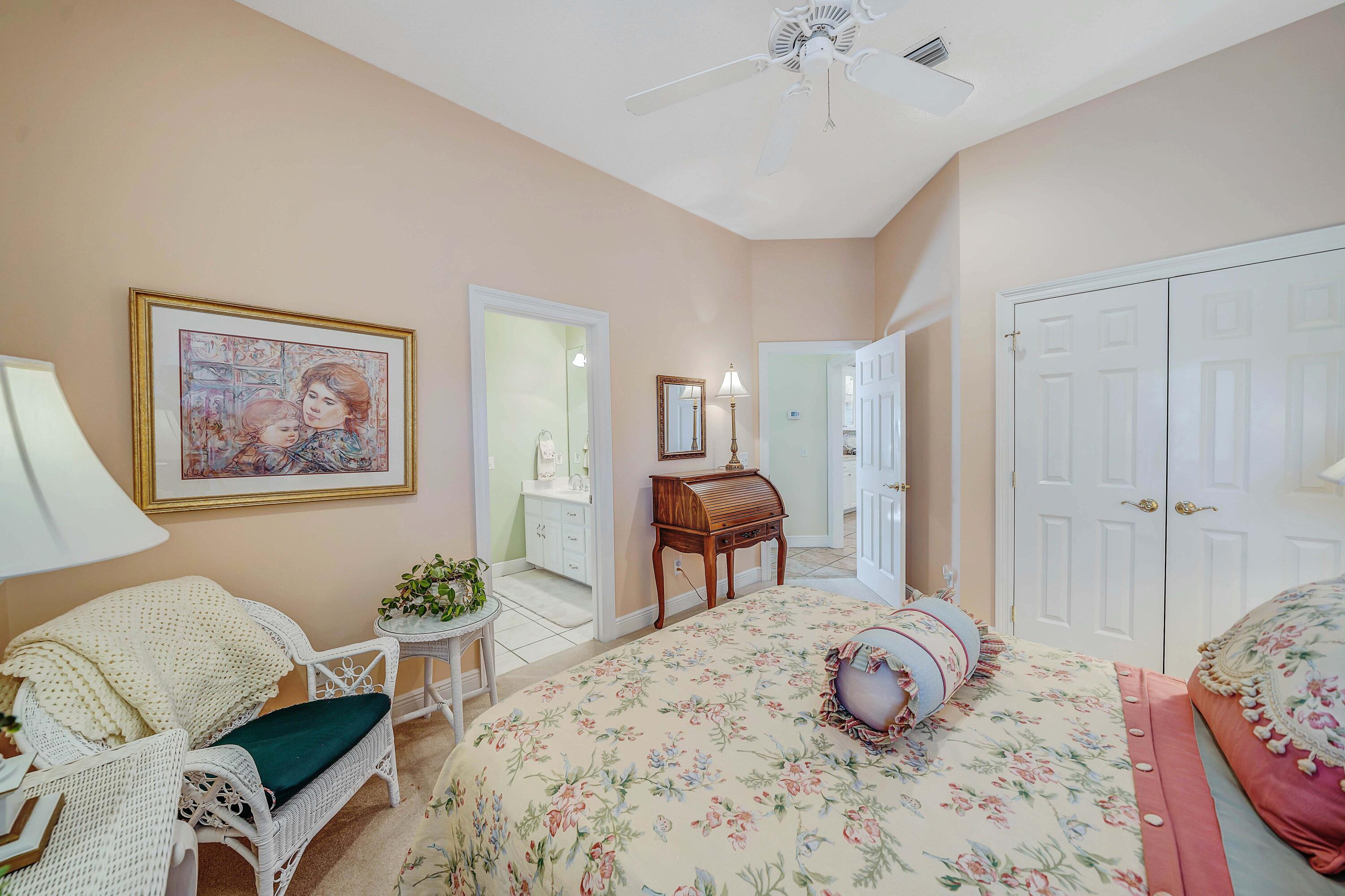 3601 Dragon's Ridge Road Panama City Beach, FL 32408 - Photo 30 of 62 a bedroom with furniture and a chandelier