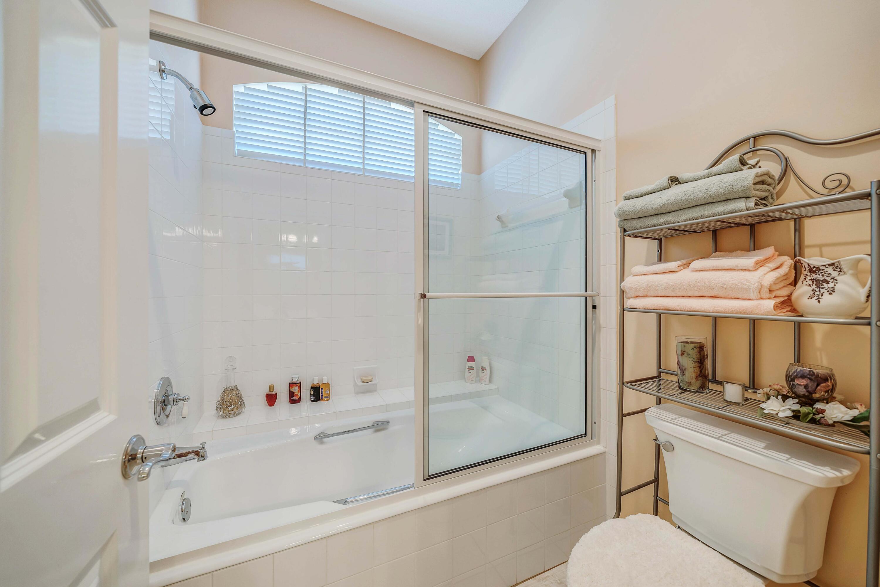 3601 Dragon's Ridge Road Panama City Beach, FL 32408 - Photo 33 of 62 a bathroom with a bathtub shower sink vanity and toilet