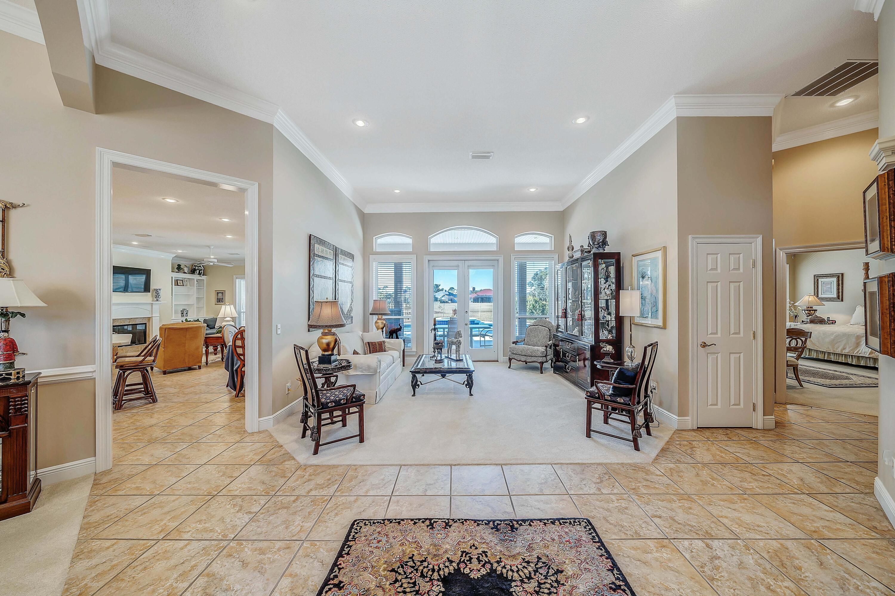 3601 Dragon's Ridge Road Panama City Beach, FL 32408 - Photo 5 of 62 a living room with lots of furniture and white walls