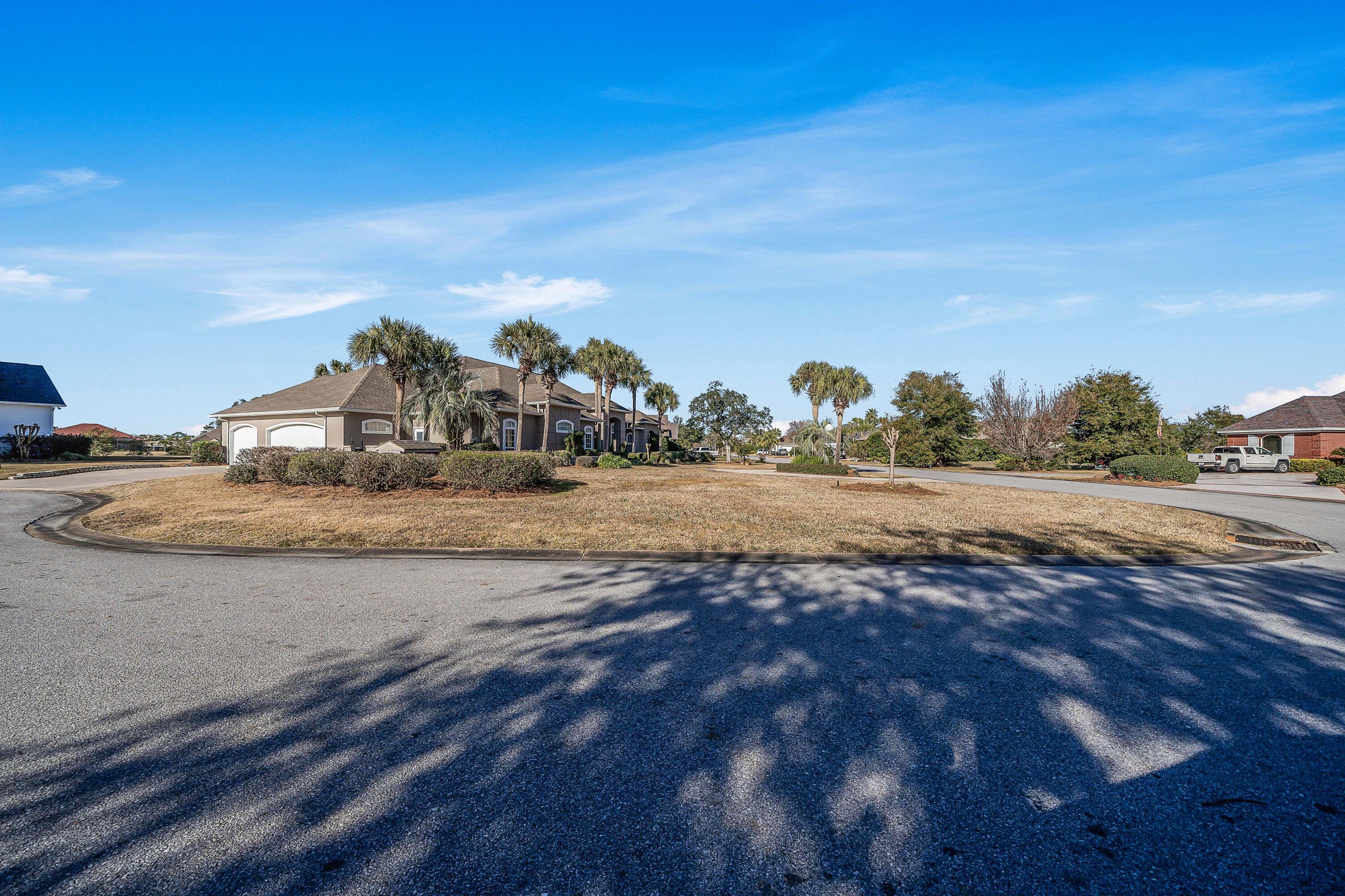 3601 Dragon's Ridge Road Panama City Beach, FL 32408 - Photo 60 of 62 a view of a dry yard with wooden fence