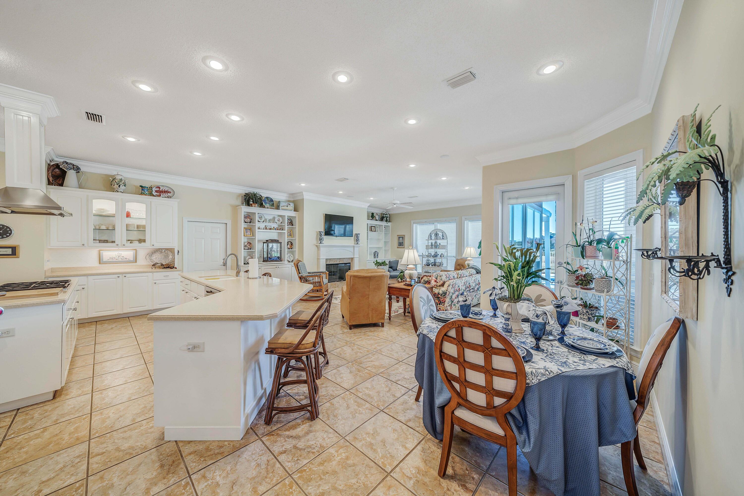3601 Dragon's Ridge Road Panama City Beach, FL 32408 - Photo 9 of 62 a living room with furniture a dining table and chairs
