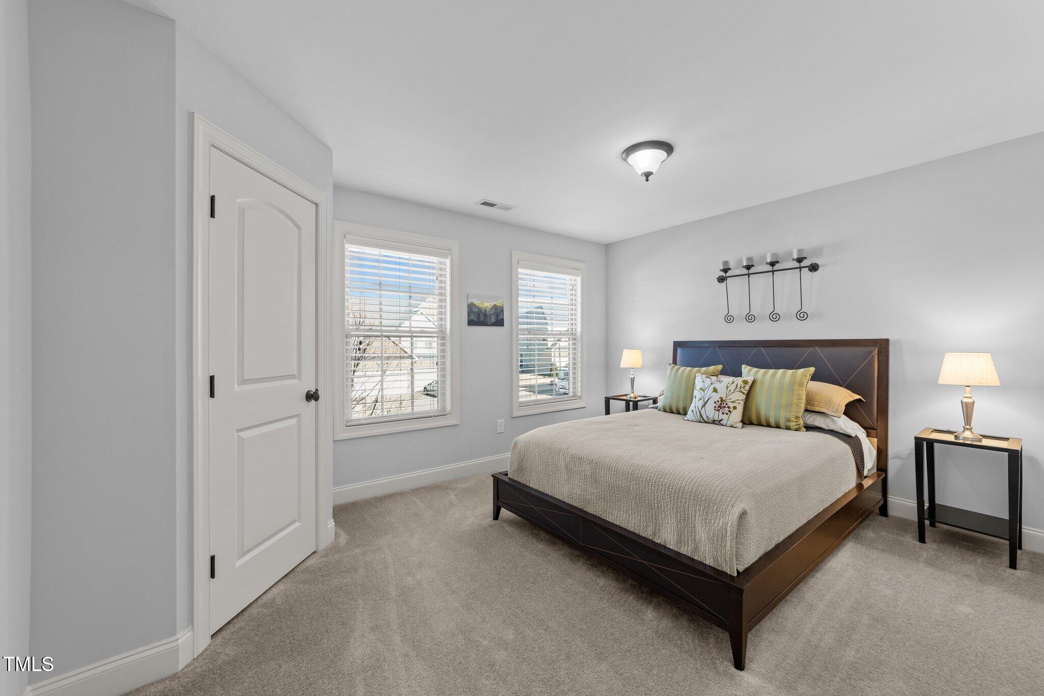 7520 Channery Way Raleigh, NC 27616 - Photo 33 of 47 a a spacious bedroom with a bed and window