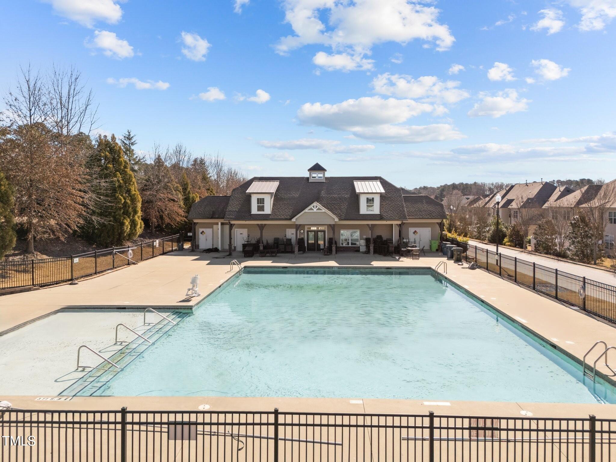 7520 Channery Way Raleigh, NC 27616 - Photo 44 of 47 a view of a swimming pool with a lawn chairs