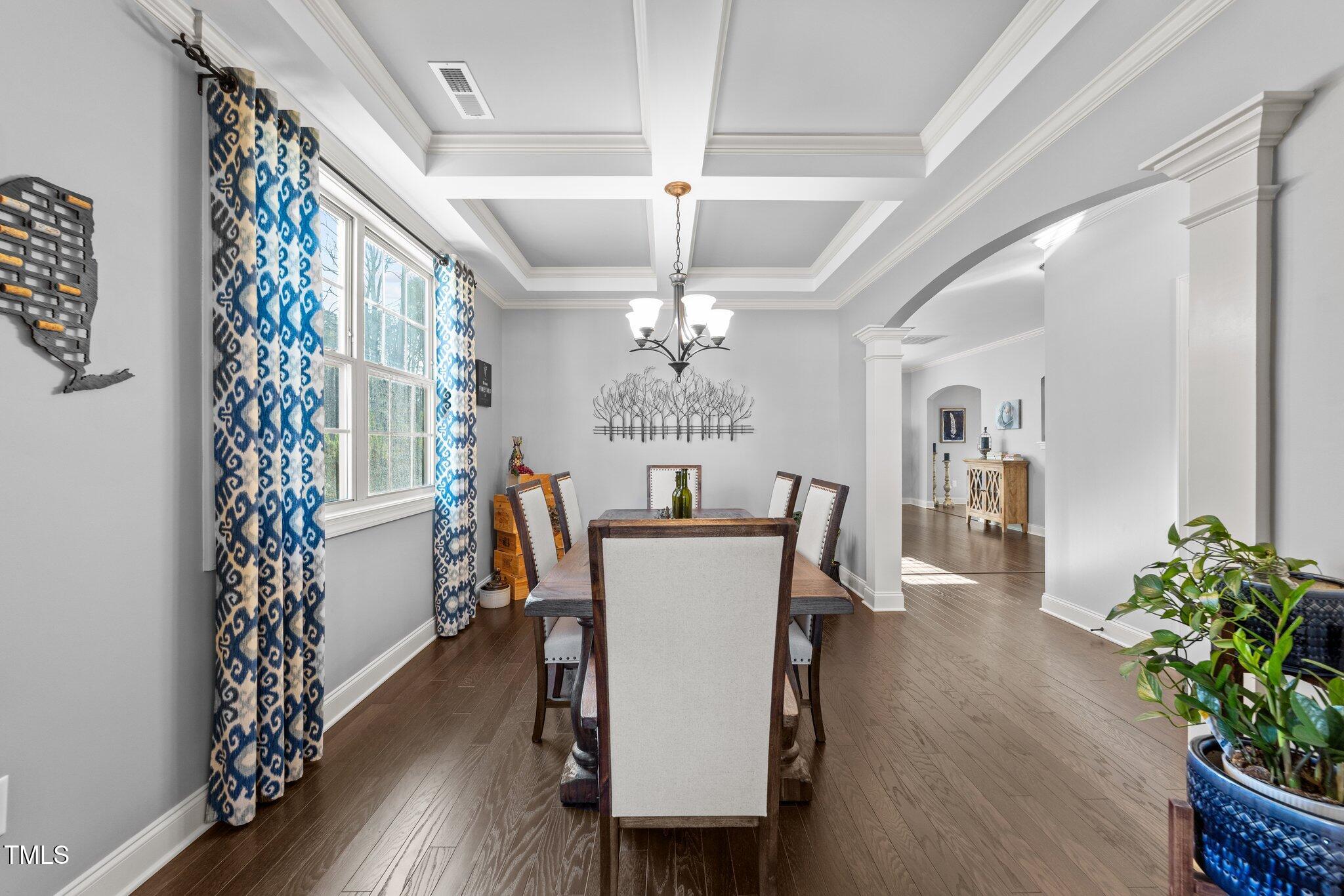 7520 Channery Way Raleigh, NC 27616 - Photo 9 of 47 a view of a dining room with furniture window and wooden floor
