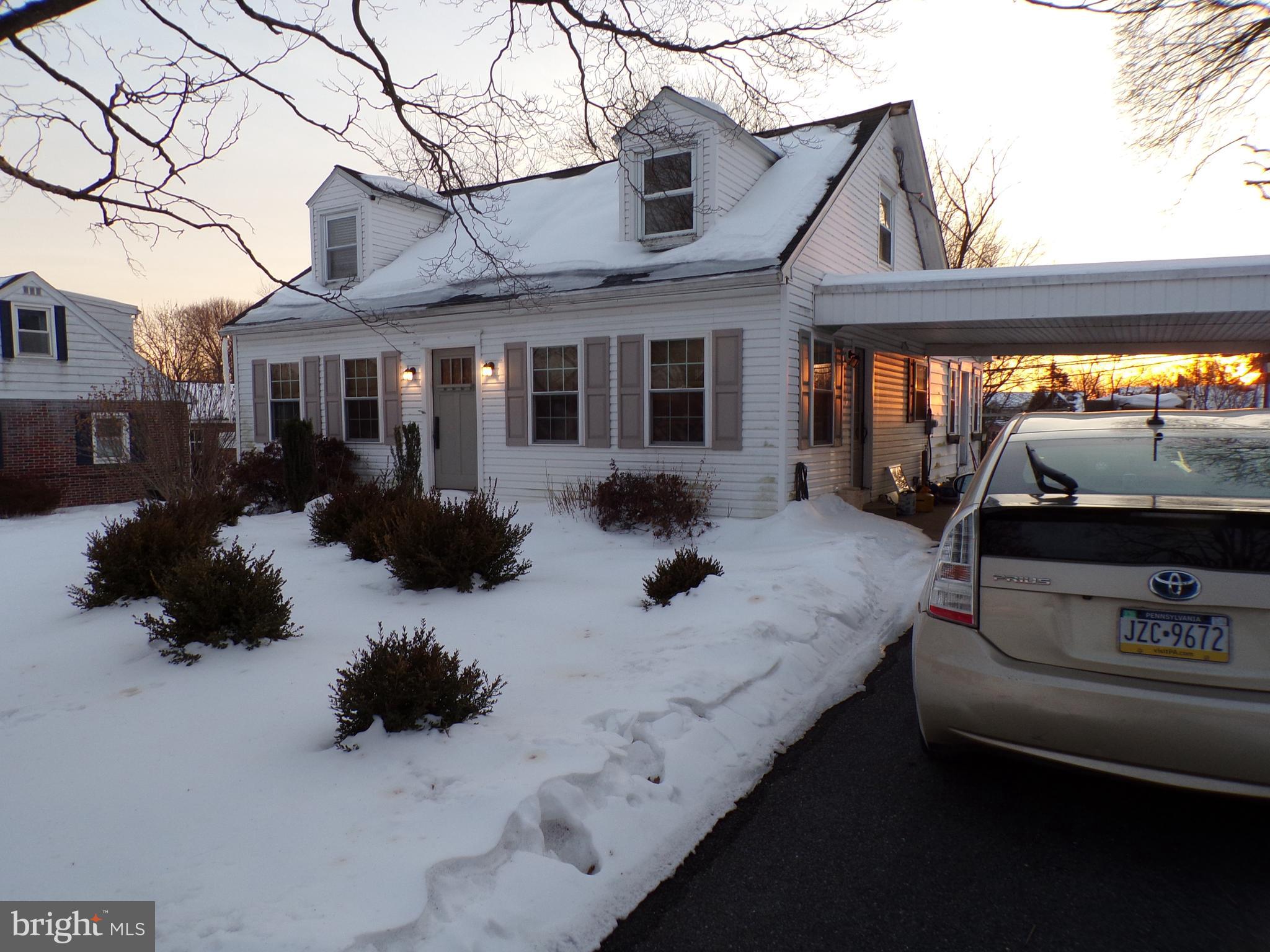 a view of a house with a yard patio