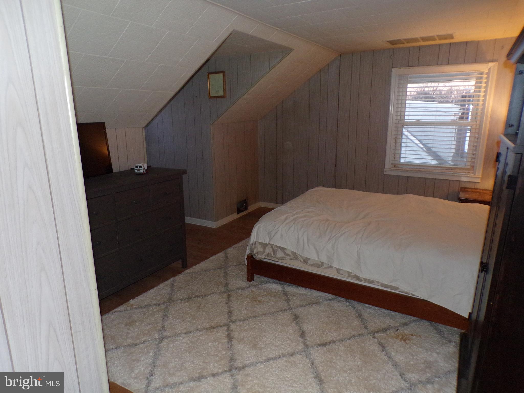 3316 Stoudts Ferry Bridge Road Reading, PA 19605 - Photo 13 of 18 a bedroom with a bed and a window