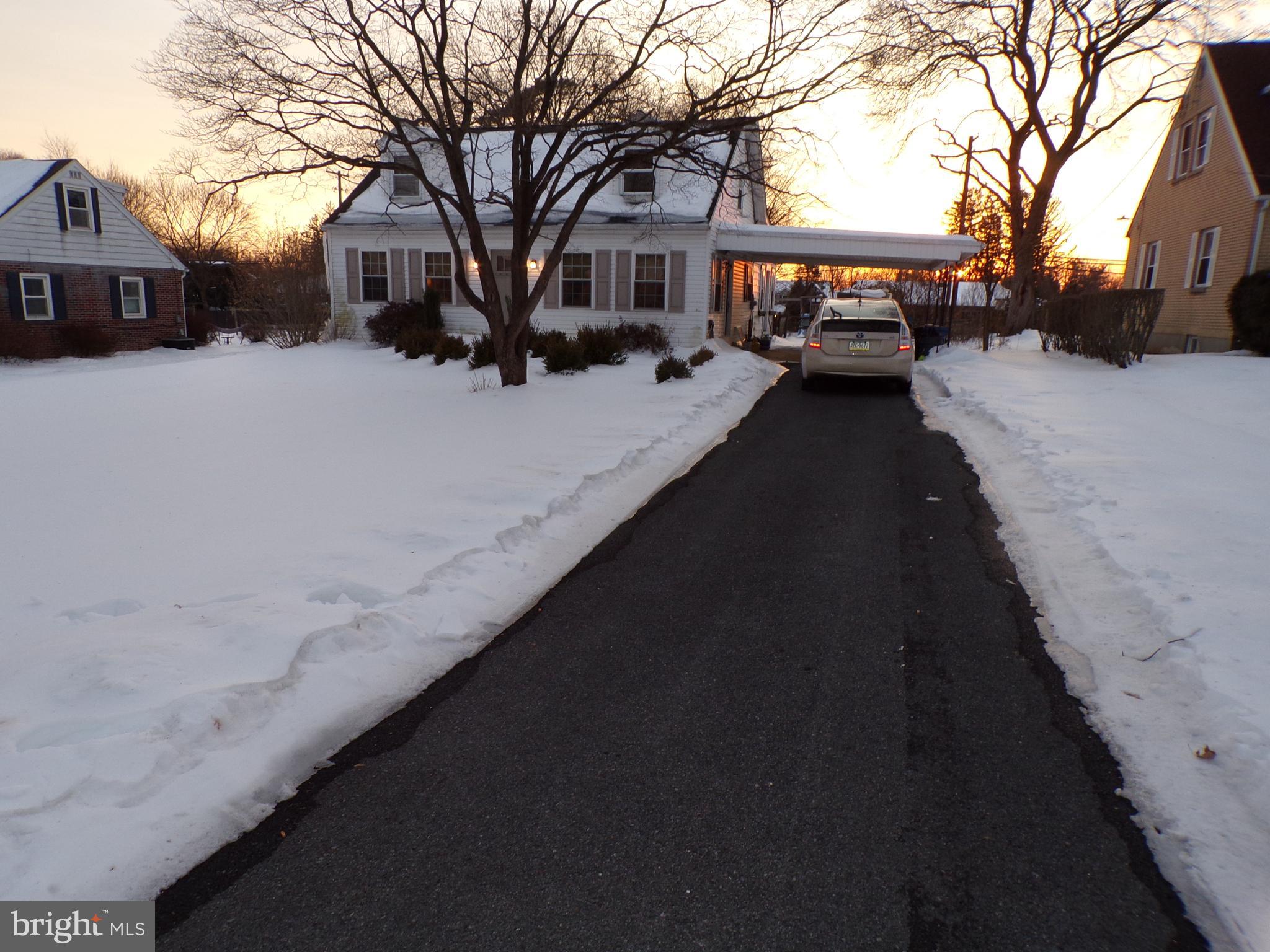 3316 Stoudts Ferry Bridge Road Reading, PA 19605 - Photo 3 of 18 a front view of a house with a yard covered in snow