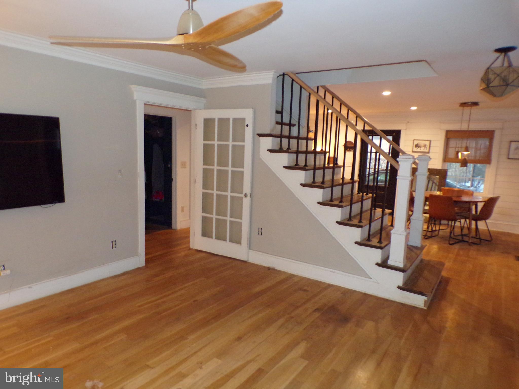 3316 Stoudts Ferry Bridge Road Reading, PA 19605 - Photo 4 of 18 a view of a hallway with wooden floor and stairs