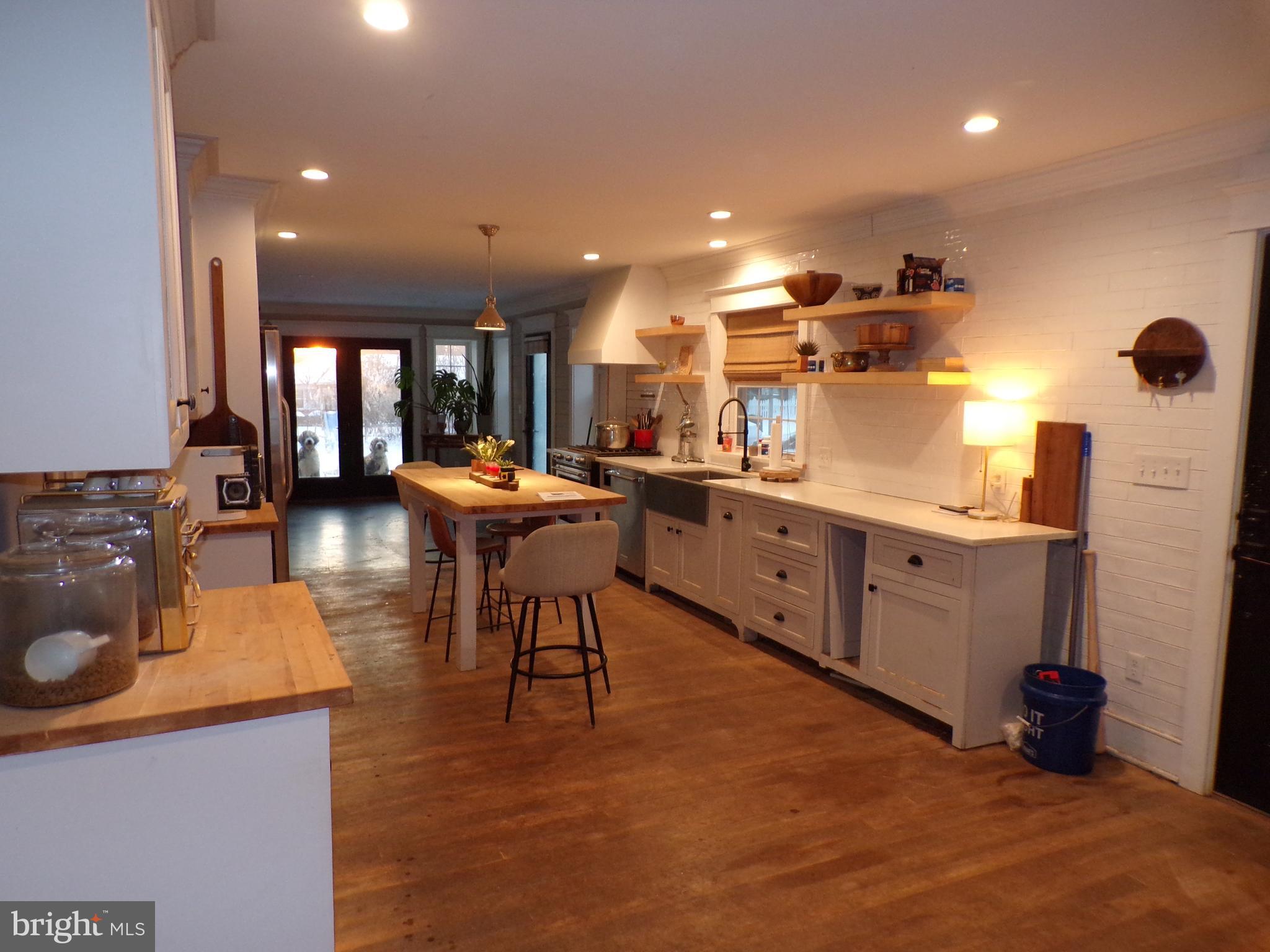 3316 Stoudts Ferry Bridge Road Reading, PA 19605 - Photo 8 of 18 a kitchen with stainless steel appliances kitchen island granite countertop a sink and cabinets
