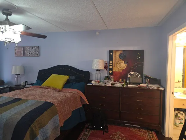 a bedroom with a bed and window