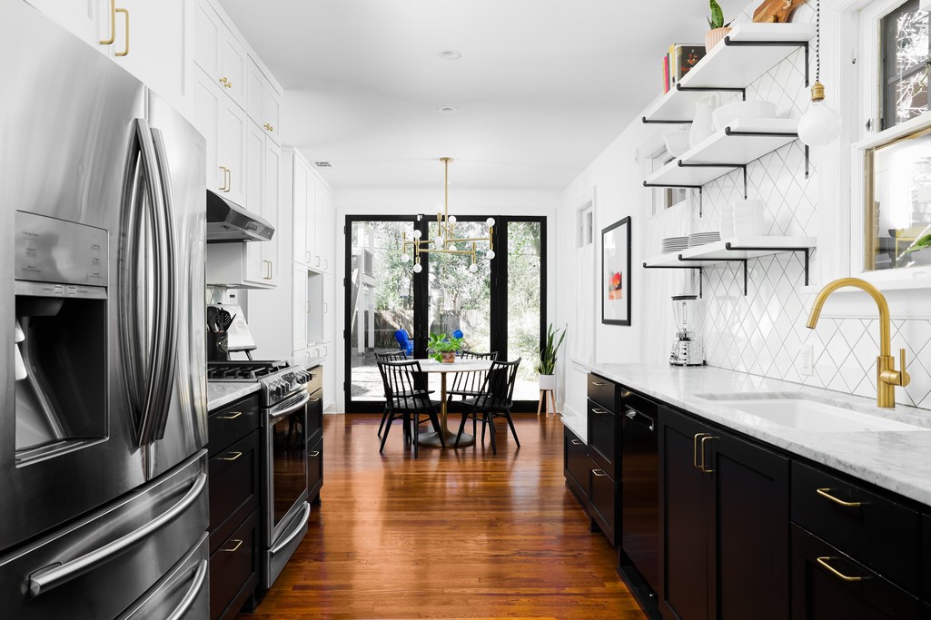 3812 Duval Street Austin, TX 78751 - Photo 10 of 22 a kitchen with stainless steel appliances a stove top oven a sink and dishwasher