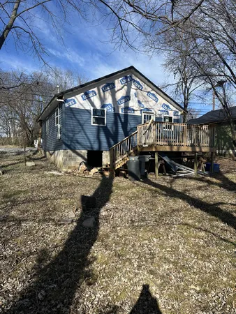 a view of house with yard