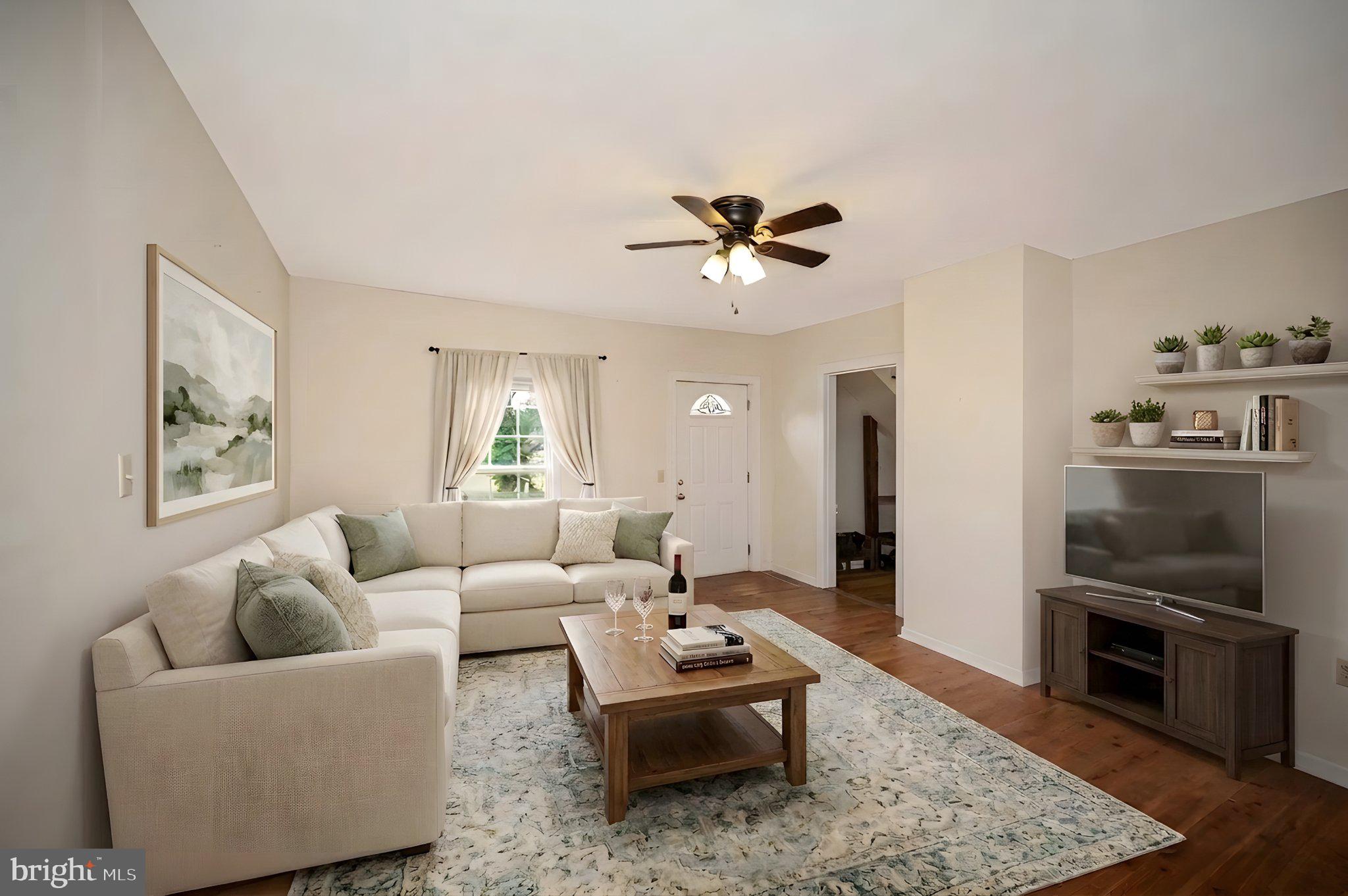 23202 Village Road Unionville, VA 22567 - Photo 5 of 58 a living room with furniture and wooden floor