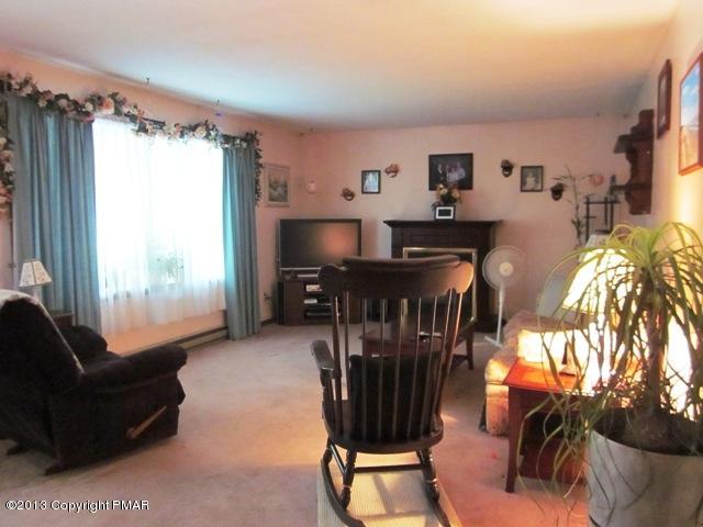 1483 Brislin Road Stroudsburg, PA 18360 - Photo 14 of 37 a living room with furniture and a window