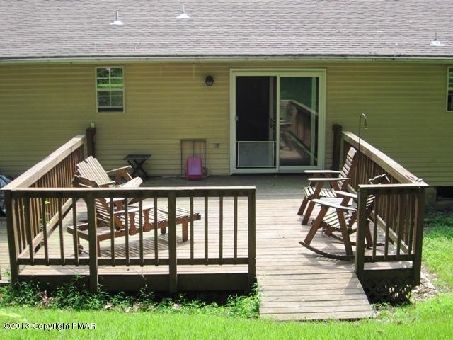 1483 Brislin Road Stroudsburg, PA 18360 - Photo 36 of 37 a view of a deck with chairs and wooden floor