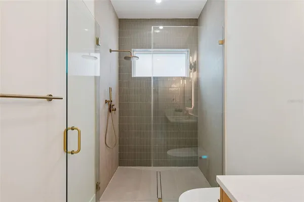 a bedroom with furniture and a chandelier