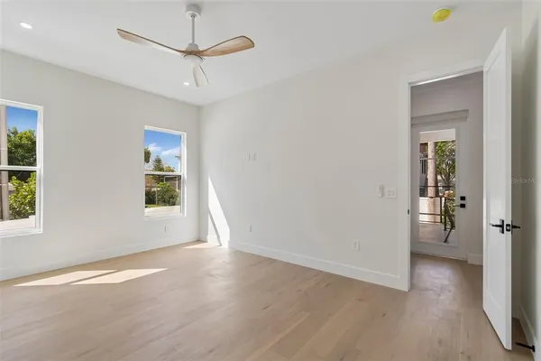 a spacious bathroom with a granite countertop sink a toilet and shower