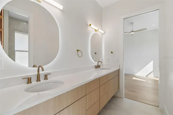 a view of an white house with a yard