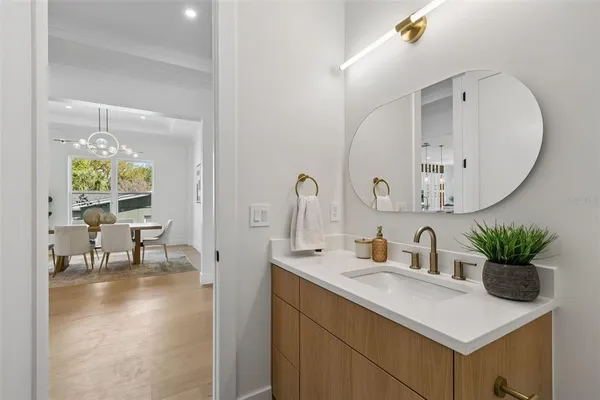 a hallway with sliding door and natural light