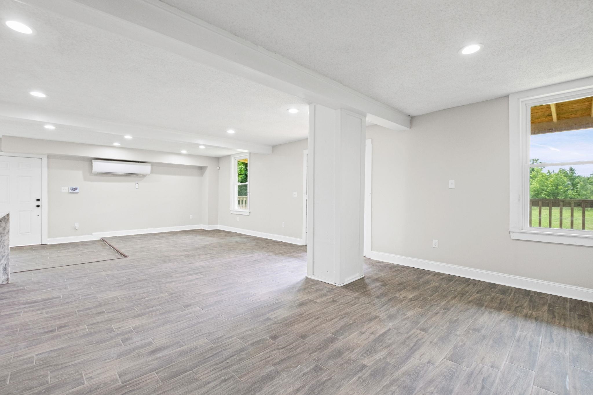 5843 Stewart Road Lakeland, TN 38002 - Photo 8 of 26 Spacious interior with wood-finish flooring, recessed lighting, and white trim