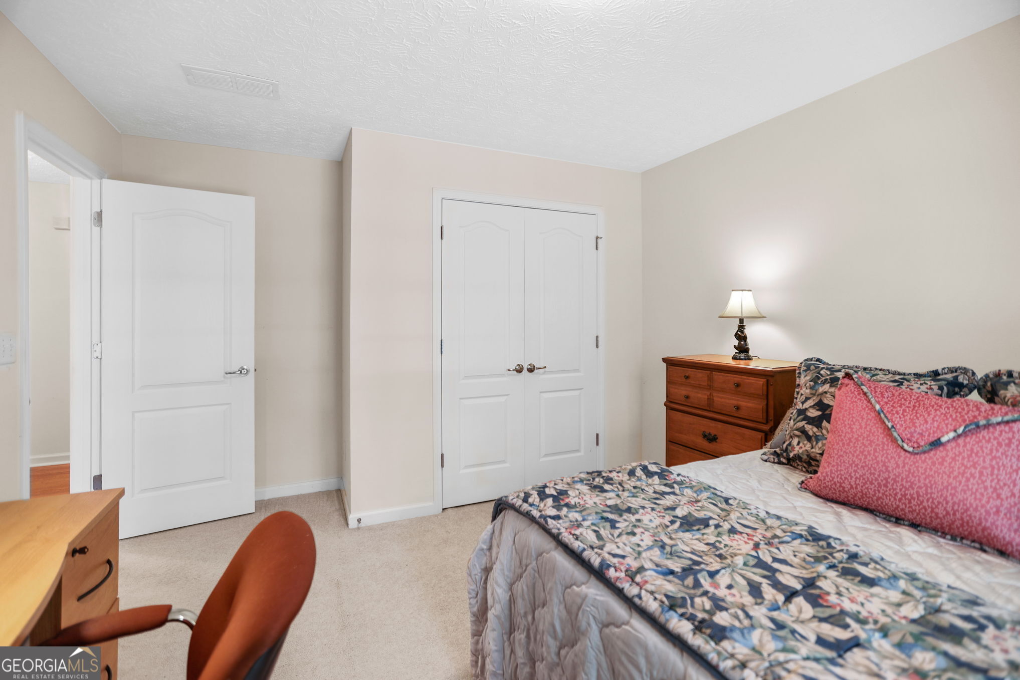 892 Brooks Woolsey Road Brooks, GA 30205 - Photo 27 of 45 a bedroom with a bed and a chair in it