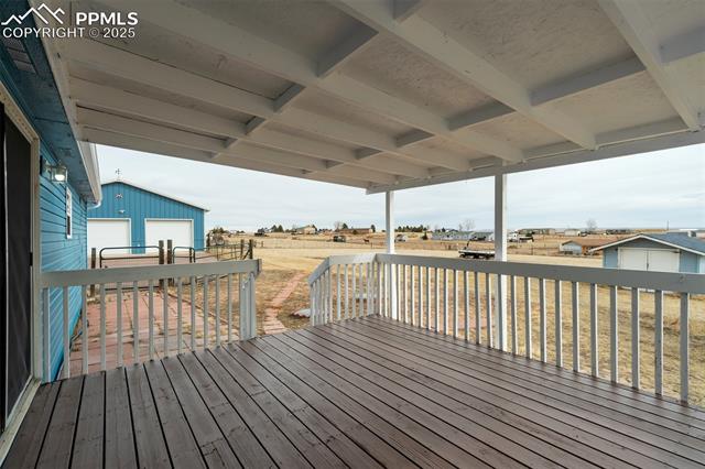 5455 Prospero Road Peyton, CO 80831 - Photo 32 of 47 Covered wood deck to the back of the home
